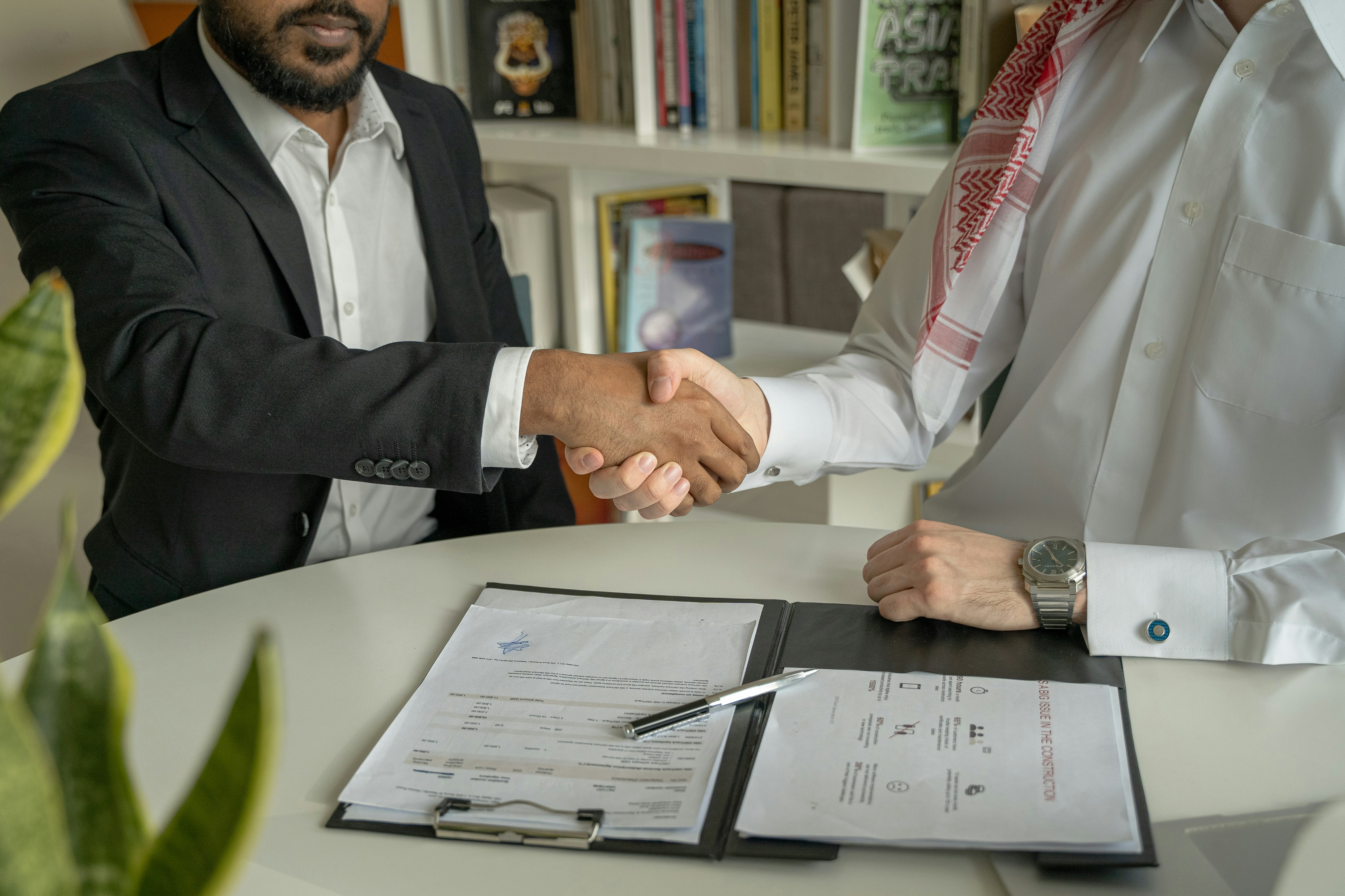Two people shaking hands when meeting